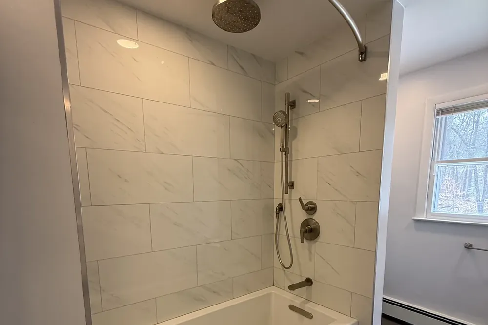 Detailed tile work in a finished Massachusetts bathroom remodel by Innov Builders