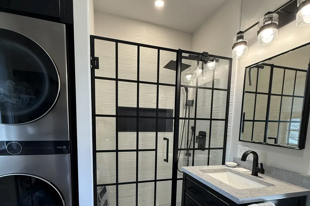 Custom vanity and finished bathroom remodel in Greater Boston by Innov Builders
