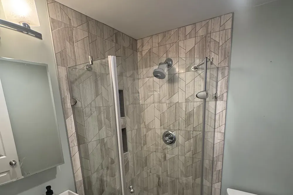 Finished walk-in tiled shower in a Wakefield, MA bathroom remodel by Innov Builders