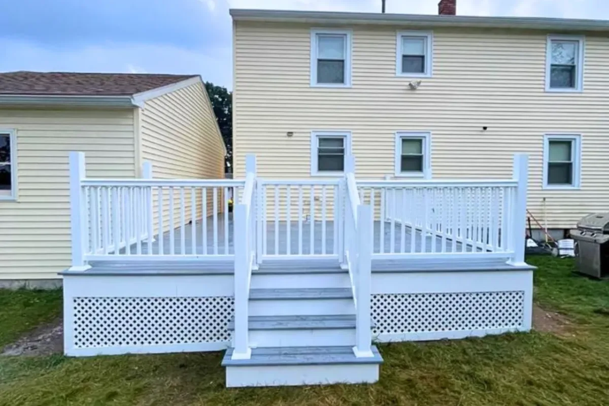 Low-maintenance composite deck with modern railings built for a North Reading, MA home by Innov Builders