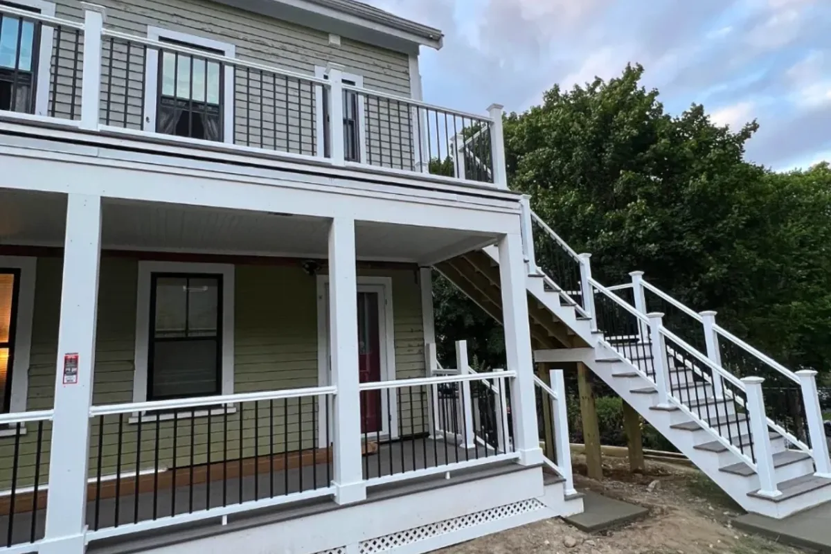 Multi-level deck stepping down a sloped North Reading, MA backyard, built by Innov Builders