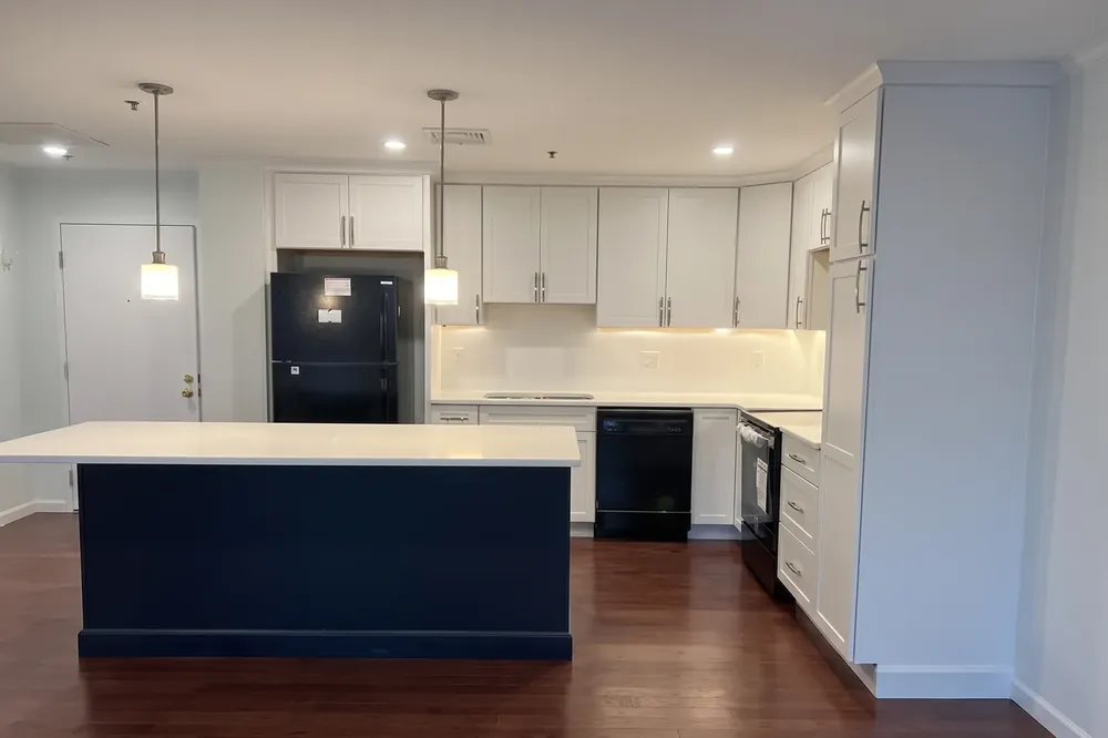 Custom kitchen cabinets and island in a Massachusetts remodel by Innov Builders