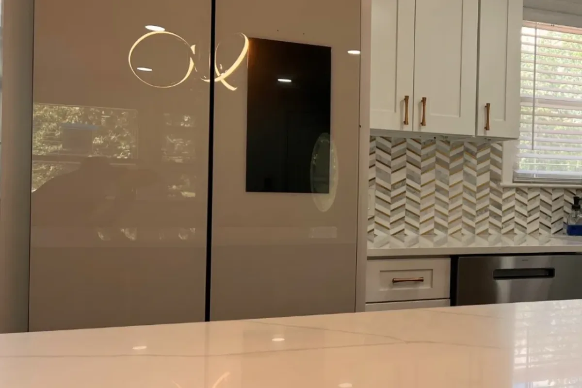 Finished modern kitchen remodel with new cabinets and quartz in North Reading, MA by Innov Builders