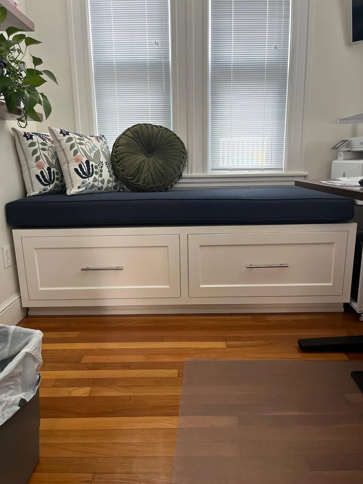 Custom built-in window seat with drawer storage in a Wakefield MA home by Innov Builders